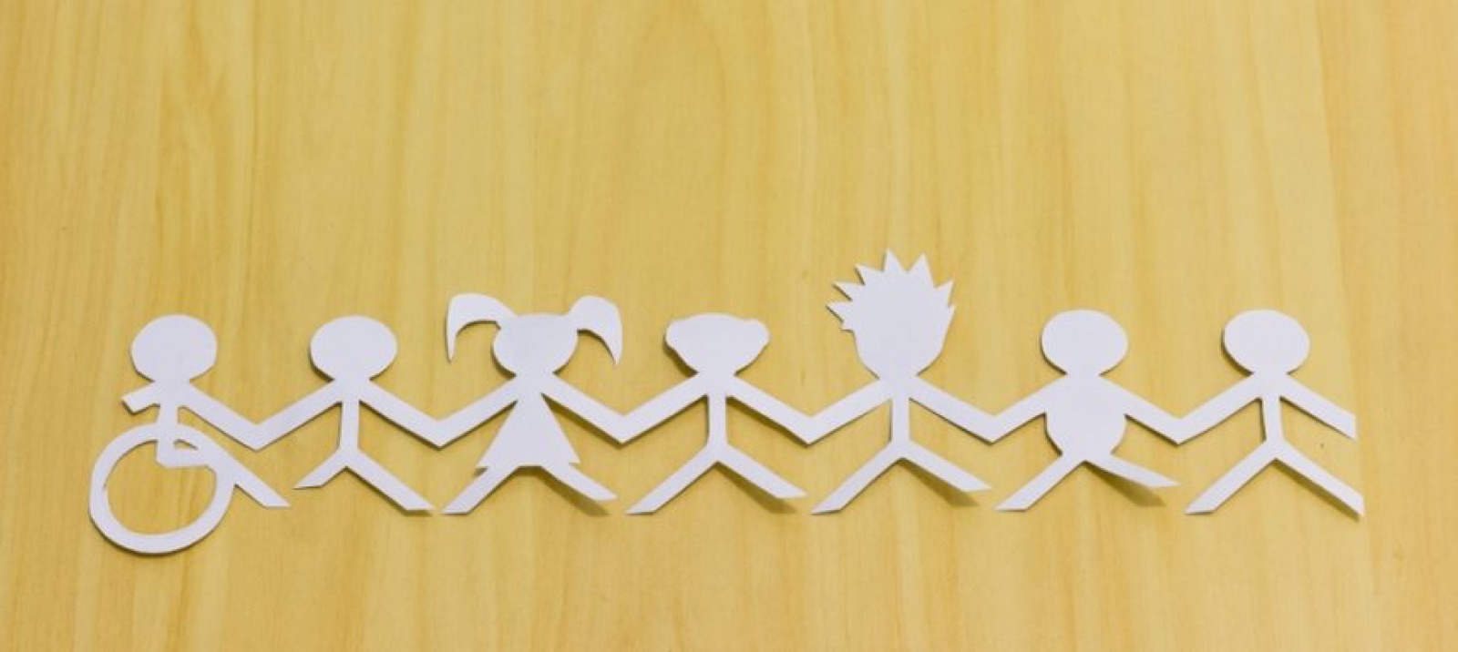 Paper chain of people of different abilities holding hands
