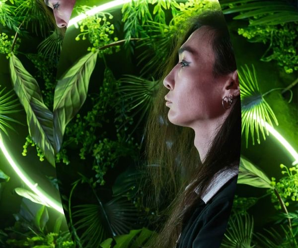 A woman among green leaves, from the Abbott Lyon case study
