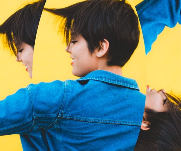 Two people in denim against a yellow background, from the Moss case study